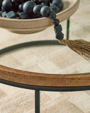 Ashley Furniture Noraluna cocktail coffee table with a sleek wooden top and modern metal legs, detailed close-up view.