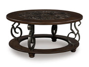 Ashley Furniture Frallyn cocktail coffee table with a sleek wooden top and sturdy legs, shown from an angled perspective.