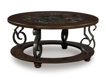 Ashley Furniture Frallyn cocktail coffee table with a sleek wooden top and sturdy legs, shown from an angled perspective.