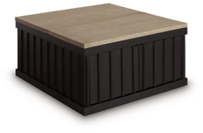 Ashley Furniture Rylandyn Lift-Top Coffee Table with closed lift-top and wooden finish, angled view showing storage space inside
