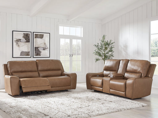 Ashley Furniture DeepWakes living room set with plush sofas and matching coffee table in a modern living space.