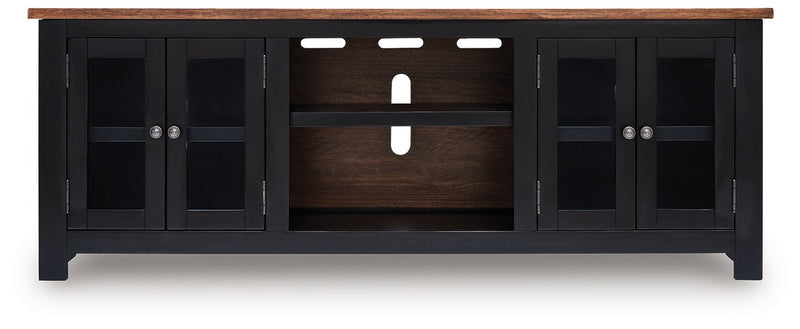 Wildenauer 76-inch TV stand by Ashley Furniture featuring a modern design with wood finish and ample storage space.